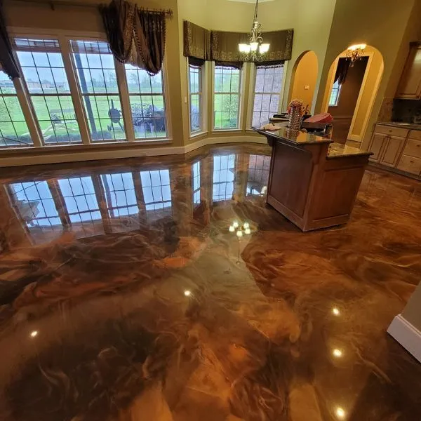 Marbled metallic epoxy floor with flowing reflective pigment in a Lee County interior